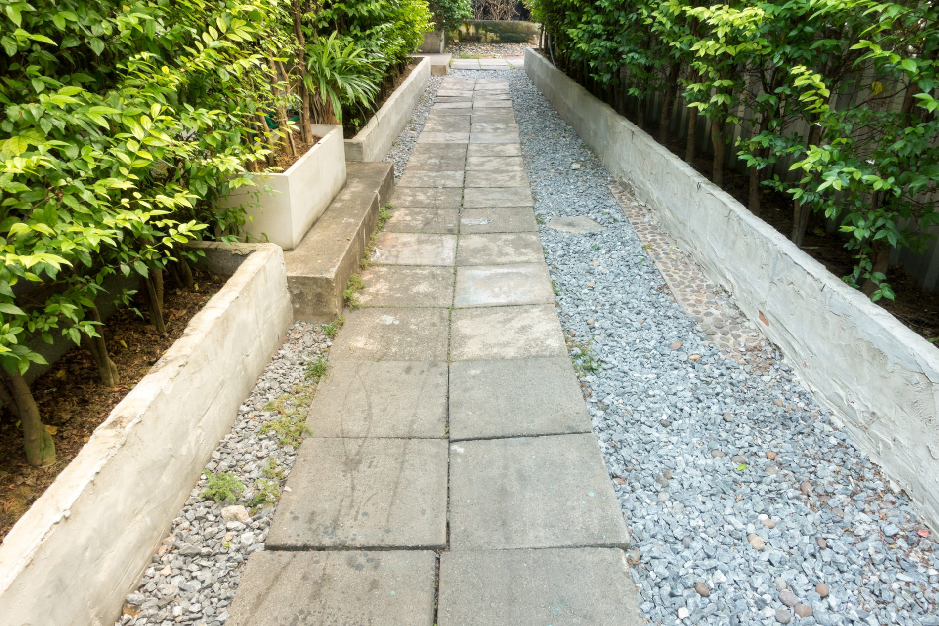 Stone and gravel pathway with landscaping